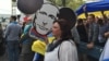 Caricature of Vladimir Putin put up by those protesting his invasion of Ukraine (VOA photo - C. Presutti).