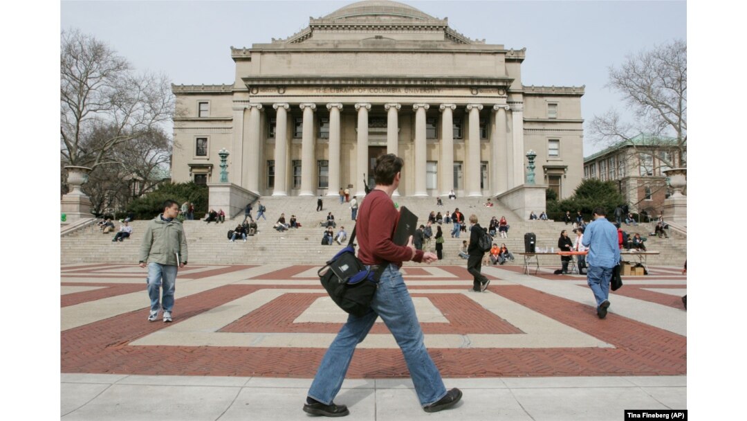 FILE - People are seen walking on the campus of Columbia University in New York on March 31, 2005. (AP Photo/Tina Fineberg)