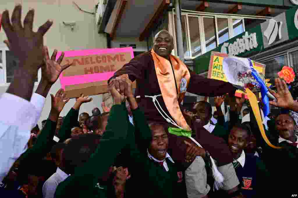 Peter Mokaya Tabichi (top), winner of the renowned Global Teacher's Prize, is welcomed by his students upon arrival at Nairobi's Jomo Kenyatta Airport in Kenya from Dubai, UAE.