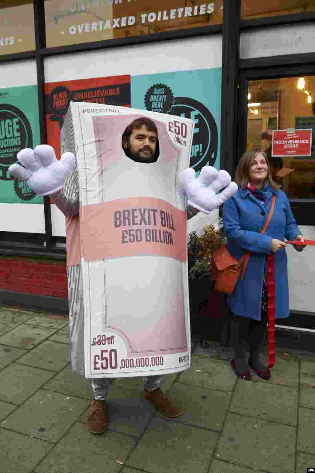 Activists perform a mock opening of a post-Brexit inspired pop-up shop, selling items with anti-Brexit themed labels and decked out in anti-Brexit posters and signs in south London, England.