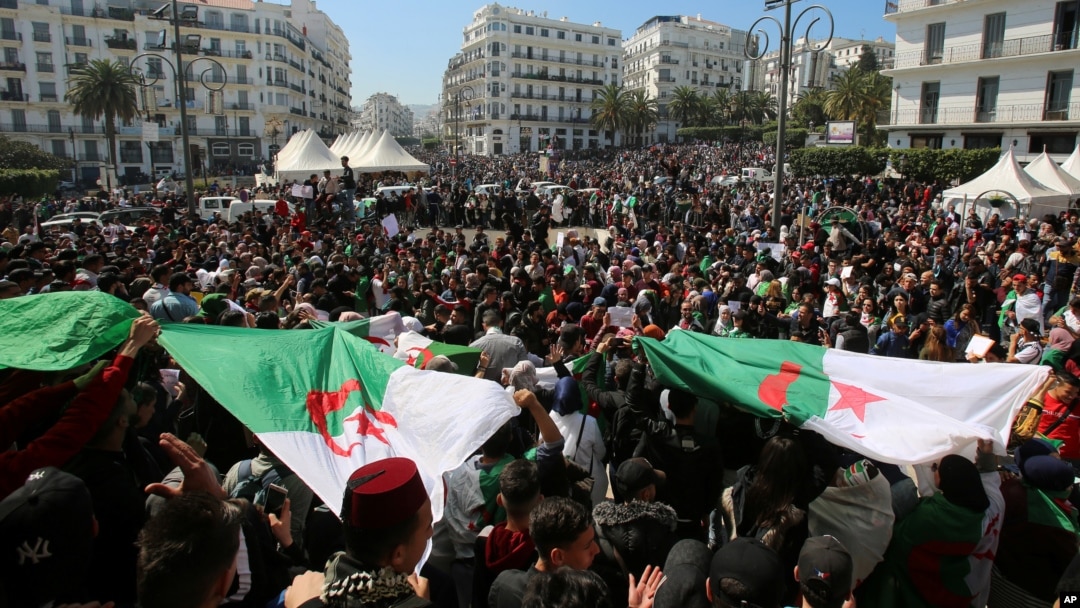People take part in a protest demanding immediate political change in Algiers, Algeria, March 12, 2019.