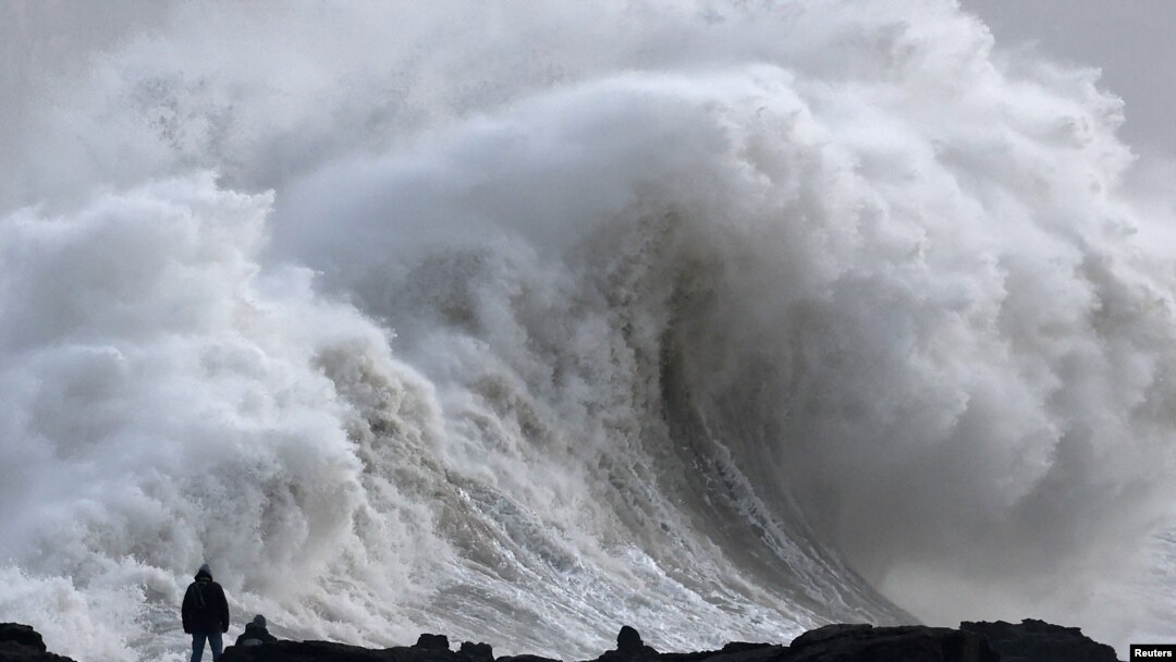 A person views large waves as Storm Eowyn arrives, in Porthcawl, Wales, Britain, Jan. 24, 2025.