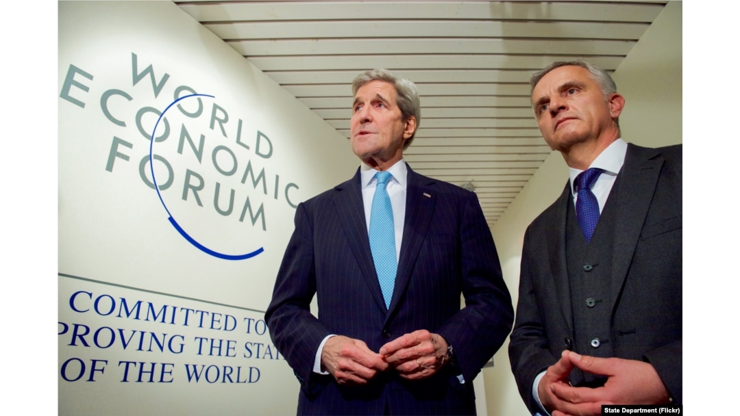 U.S. Secretary of State John Kerry shakes hands with Switzerland Foreign Minister Didier Burkhalter, at the World Economic Forum in Davos, Switzerland, Jan 21, 2016.