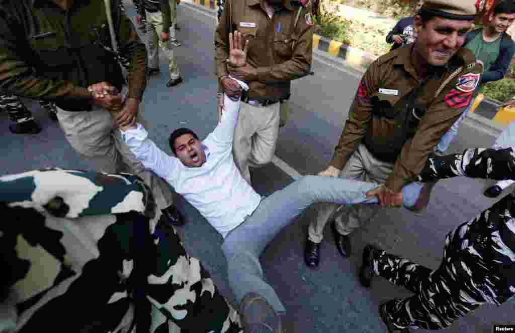 Police officers detain an activist of the Delhi Pradesh Youth Congress during a protest demanding resignations of India’s Prime Minister Narendra Modi and Defense Minister Nirmala Sitharaman over allegations of corruption in a Rafale fighter planes deal with France, New Delhi.