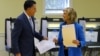 Republican presidential nominee Mitt Romney and his wife Ann finish filling out their ballots while voting during the U.S. presidential election in Belmont, Massachusetts November 6, 2012. 