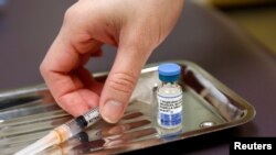 FILE PHOTO: A vial of the measles, mumps, and rubella virus (MMR) vaccine is pictured at the International Community Health Services clinic in Seattle, Washington, March 20, 2019.