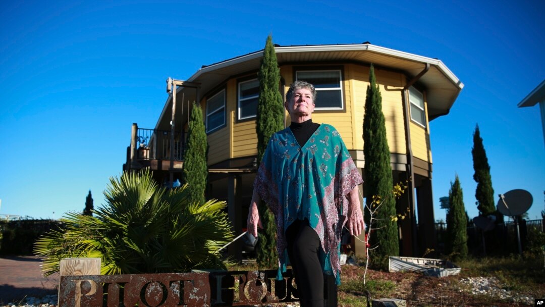 Bonny Paulson stands in front of her home in Mexico Beach, Fla. on Thursday, Oct. 19, 2023. The hurricane resistant house, designed by Deltec, was one of the few remaining structures left after Hurricane Michael hit the area in 2018.