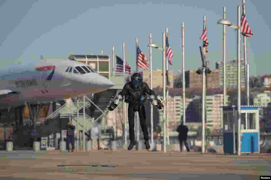 Sam Rogers, flight suit design engineer at Gravity Industries, demonstrates a Jet Suit at the Intrepid Sea, Air & Space Museum in New York, April 3, 2019.