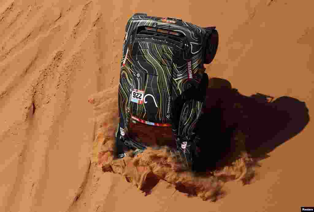 GCK Motorsport's Guerlain Chicherit and co-driver Alex Winocq crash during stage 4 of the annual Dakar Rally, from Al Qaysumah to Riyadh, Saudi Arabia.