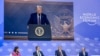 TotalEnergies chairman and CEO Patrick Pouyanne (2ndR) asks a question to US President Donald Trump (on screen) during his address by video conference at the World Economic Forum (WEF) annual meeting in Davos on January 23, 2025.