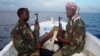 FILE - Somali pirates are shown in February 2012.
