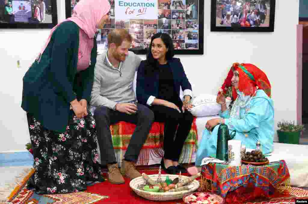 Britain's Prince Harry and Meghan, Duchess of Sussex, attend a Henna ceremony as they visit a boarding house for girls run by the Moroccan NGO 'Education for All' in Asni, Morocco.