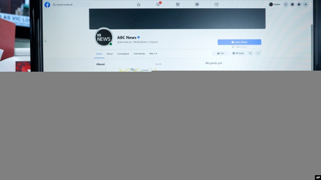 An Australian Broadcasting Corporation page on Facebook is displayed without posts in Sydney, Feb. 18, 2021. Facebook is vowing to restrict news sharing as Australian lawmakers consider forcing digital giants into payment agreements.