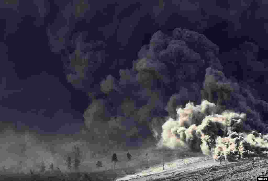 Hot lava from Mount Sinabung volcano hits trees as seen from Berastepu village in Karo district, Indonesia's North Sumatra province.