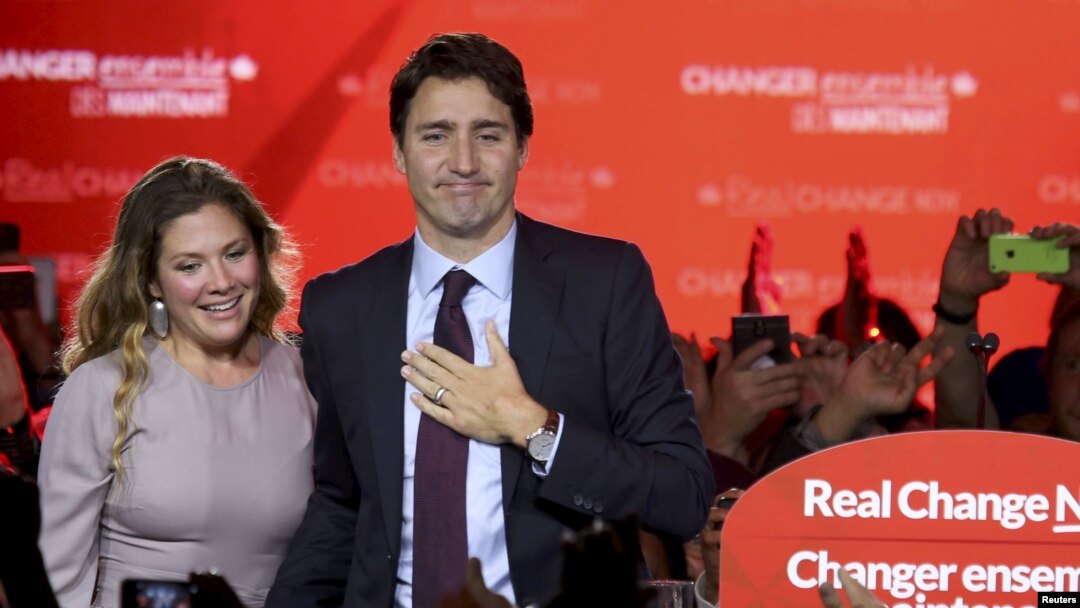 Liberal Party leader Justin Trudeau stands with his wife, Sophie Gregoire, as he gives his victory speech after Canada's federal election in Montreal, Quebec, Oct. 19, 2015. 