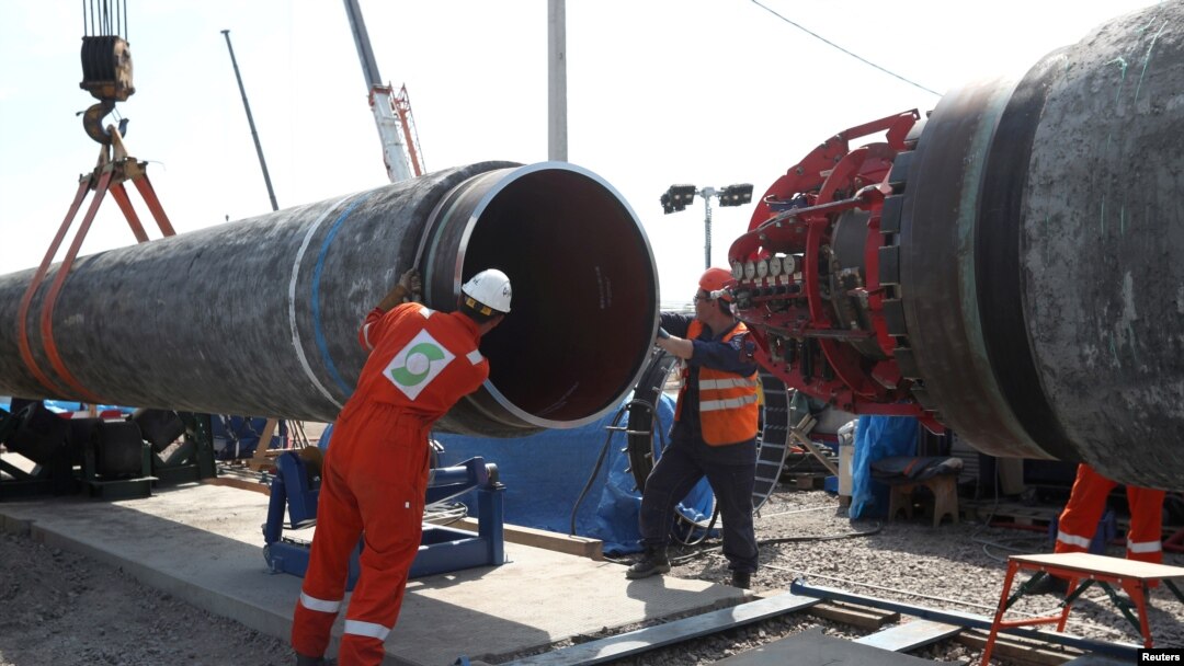 FILE - Workers are seen at the construction site of the Nord Stream 2 gas pipeline, near the town of Kingisepp, Leningrad region, Russia, June 5, 2019. 