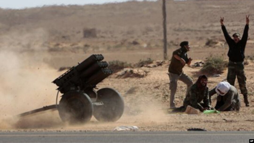 Libyan rebels fire multiple launcher rockets during a fight against pro-Gadhafi fighters near the town of Bin-Jawad, eastern Libya, Sunday, March 6, 2011.
