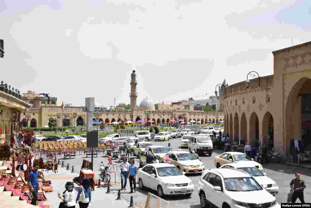 The daily rush in one of the city's most crowded squares, in Irbil, Iraq.