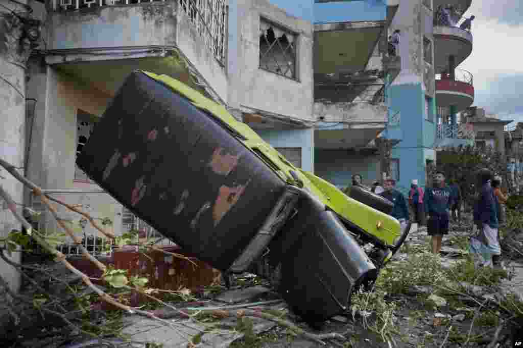 A truck is toppled by a tornado in Havana, Cuba. A tornado and pounding rains smashed into the eastern part of Cuba's capital overnight, toppling trees, bending power poles and flinging shards of metal roofing through the air as the storm cut a path of destruction across eastern Havana.