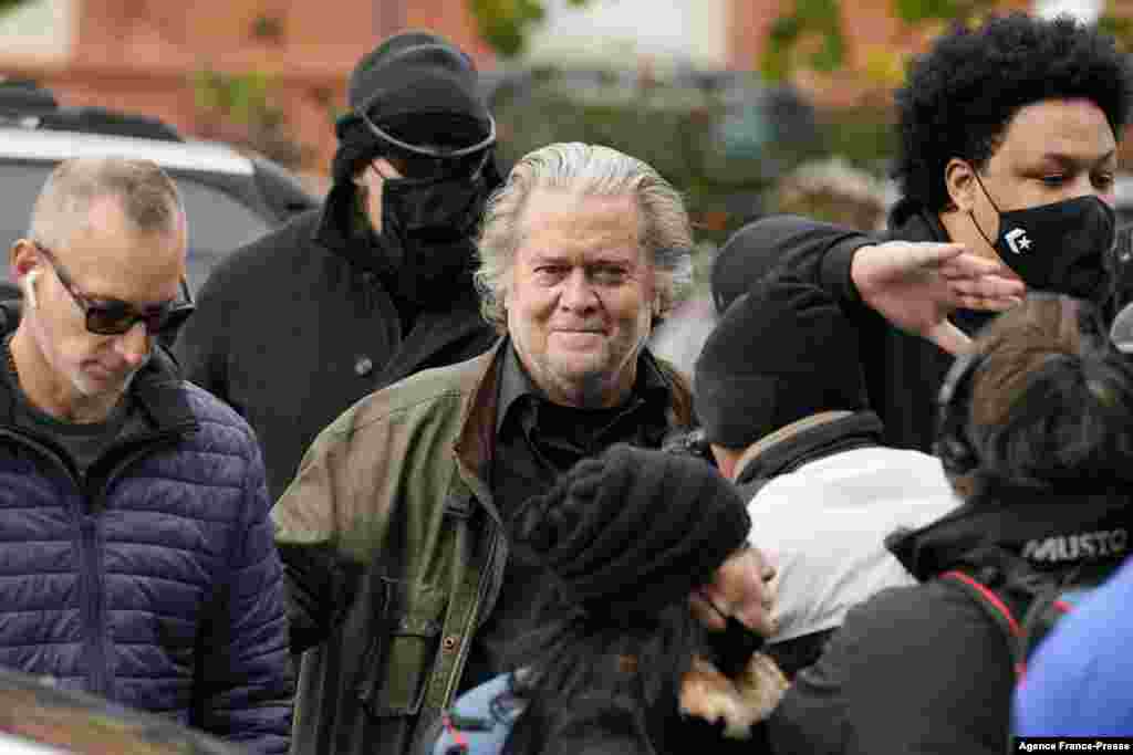 Former White House strategist Steve Bannon arrives at the FBI Washington Field Office, in Washington. The longtime ally of former President Donald Trump surrendered to federal authorities after being indicted on two counts of criminal contempt of Congress.