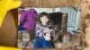 A childhood photo of Samira Zoobi, a 28-year-old who died in Hurricane Helene, was returned to their parents. (Taylor Schenker via AP)