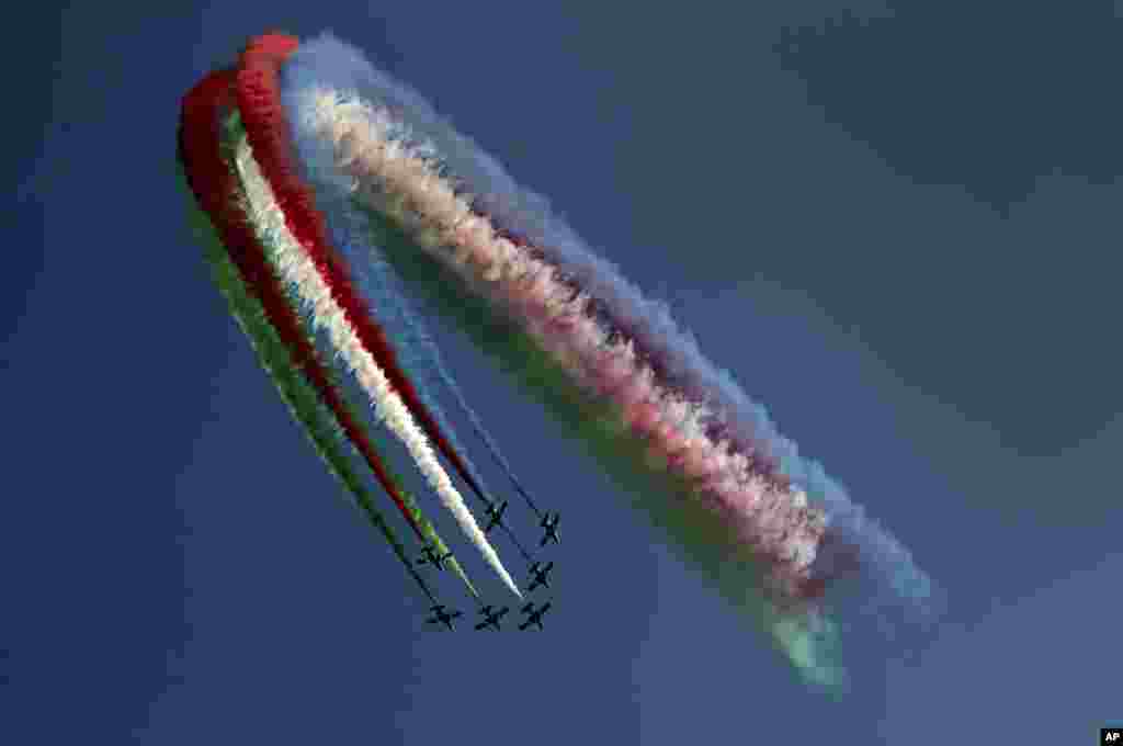 Al Fursan, the United Arab Emirates Air Force's aerobatic team, performs during the UAE 50th National Day Al Fursan, at EXPO 2020 Dubai, in Dubai.