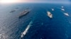 Aircraft carriers and warships participate in the second phase of Malabar naval exercise, a joint exercise comprising of India, US, Japan and Australia, in the Northern Arabian Sea on Tuesday, Nov. 17, 2020. 