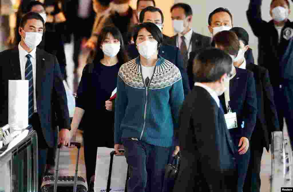 Mako Komuro, former Japan's Princess Mako and the eldest daughter of Crown Prince Akishino and Crown Princess Kiko, and her newly married husband Kei board a flight bound for New York to start their new life in the U.S. at Haneda airport in Tokyo, Japan.