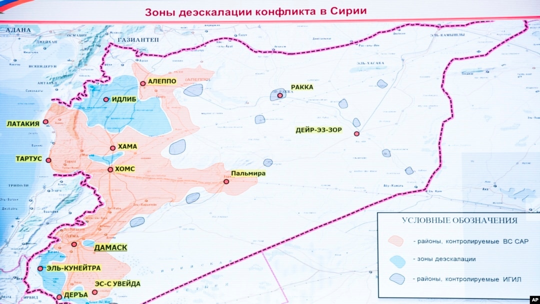 The agreement setting up four de-escalation zones in Syria went into effect at midnight, May 5, 2017. The sign on top of the map reads Syrian safe zones.