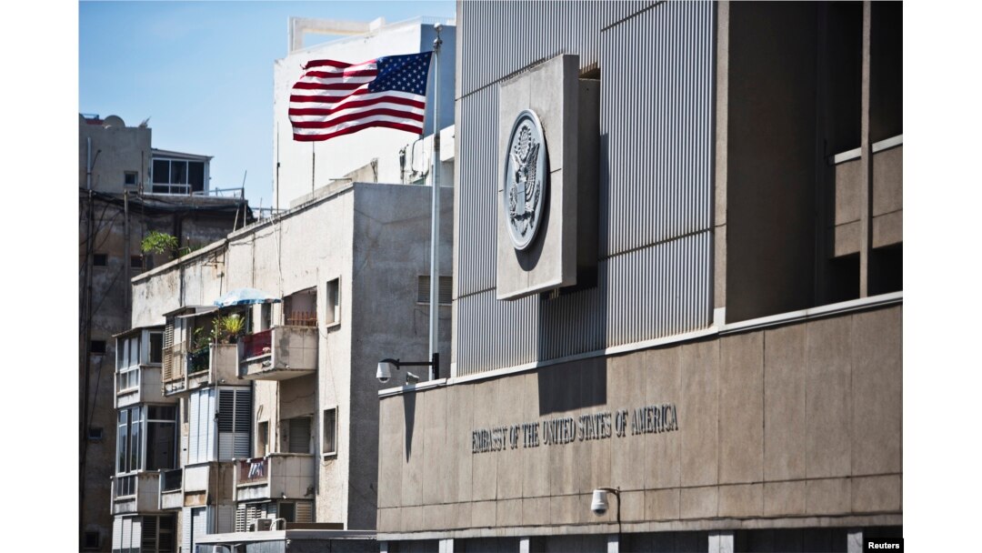 FILE - A flag flutters outside the U.S. embassy in Tel Aviv August 4, 2013.