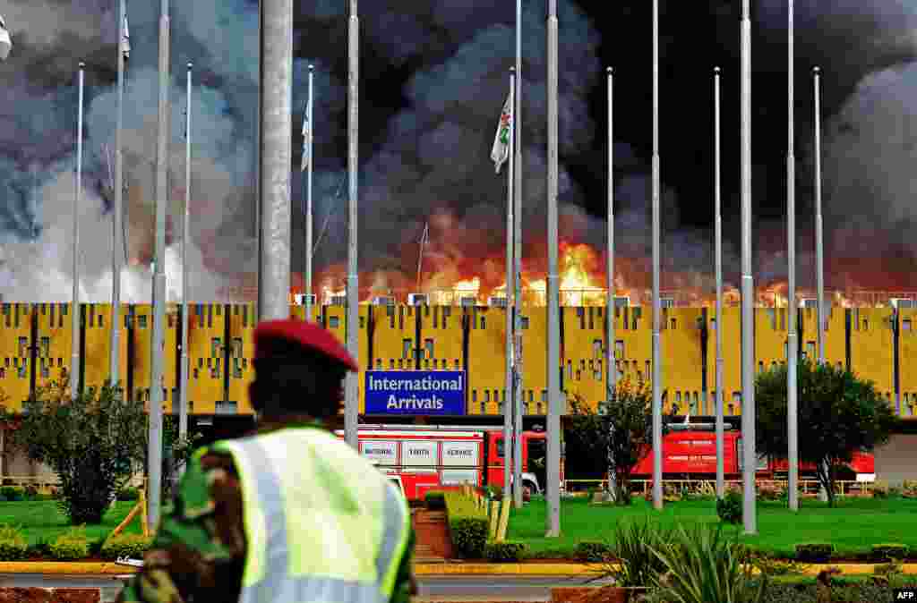 Flames and black smoke billow from the burning Jomo Kenyatta international airport, Nairobi, Kenya. A massive fire shut down Nairobi's international airport with flights diverted to regional cities as firefighters battled to put out the blaze in east Africa's biggest transport hub.