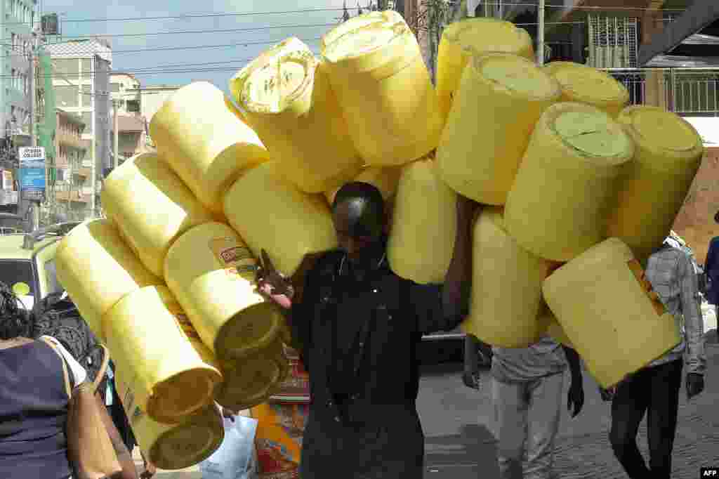 A man carries empty jerry cans in the Somali neighborhood of Eastleigh in Nairobi, Kenya.