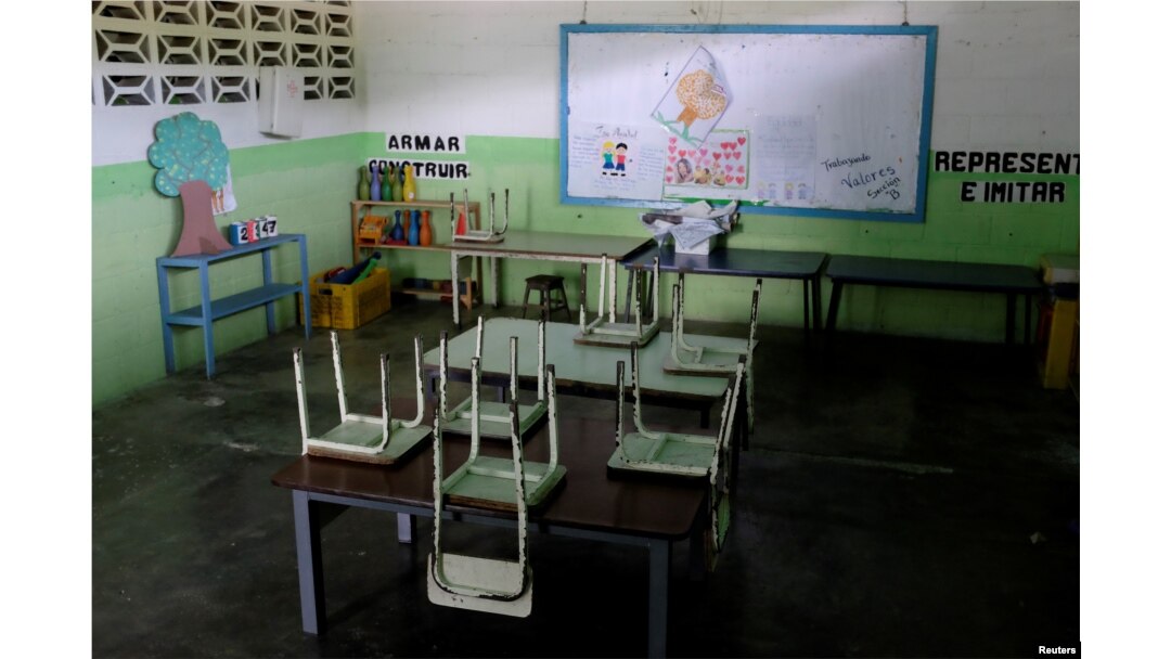 Empty desks are seen in a classroom on the first day of school, in Caucagua, Venezuela, Sept. 17, 2018.