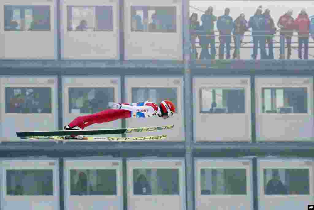 Germany's Eric Frenzel soars through the air during the ski jumping portion of the Nordic Combined, at the Nordic Ski World Championships in Innsbruck, Austria.