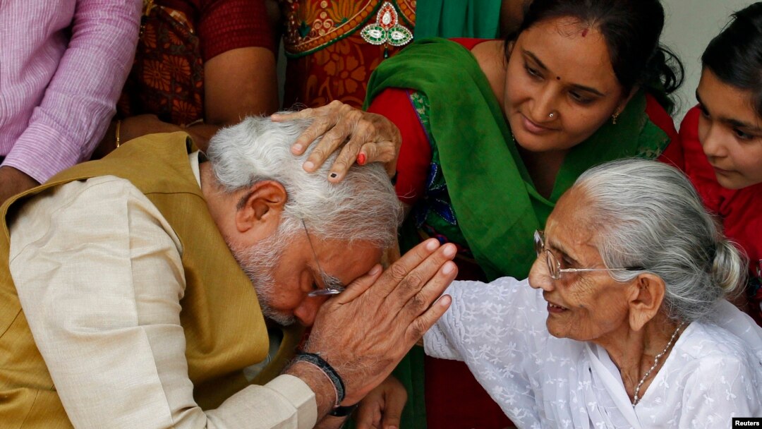 Sometimes, even world leaders have to get permission from the mothers. Here, Hindu nationalist Narendra Modi, India's new prime minister, seeks blessings from his mother.