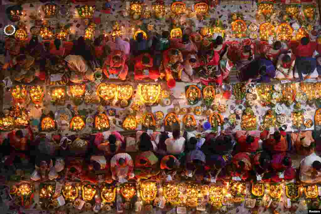 Hindu devotees observe the third day of Rakher Upabashin in a temple in Dhaka, Bangladesh, Nov. 10, 2018.