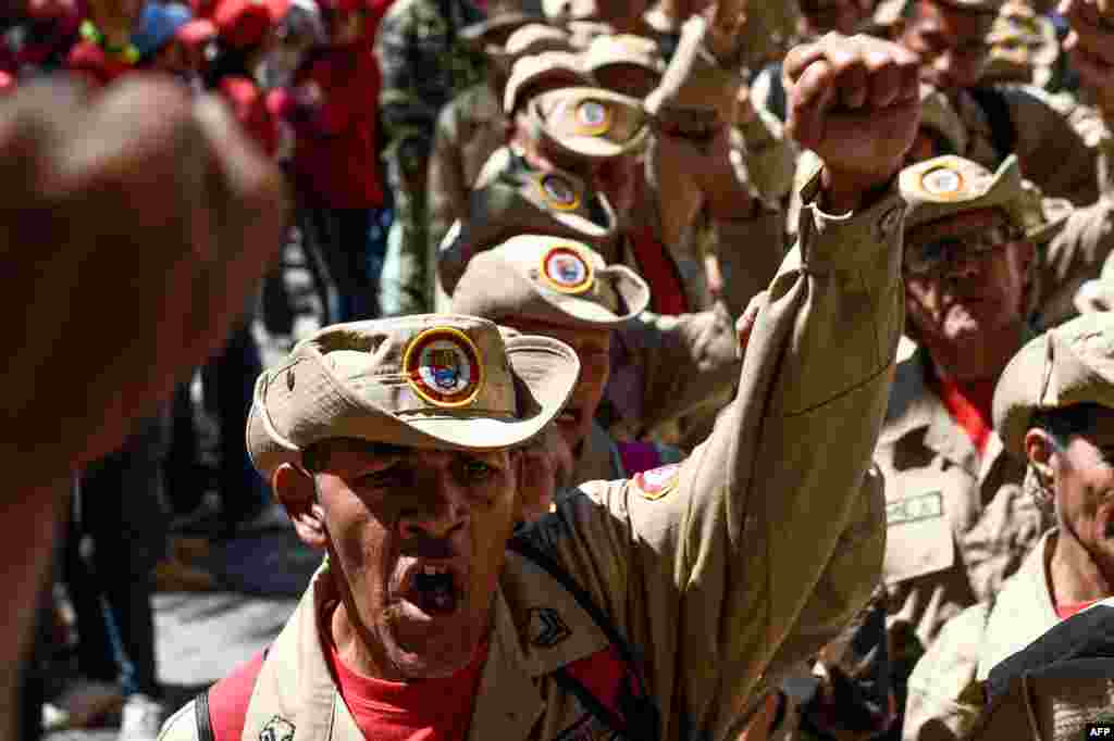 Members of Venezuela's Bolivarian militia demonstrate in support of President Nicolas Maduro during a commemoration for the '27th Anniversary of the Military Rebellion of the 4FEB92 and National Dignity Day,' at Bolivar Square in Caracas.