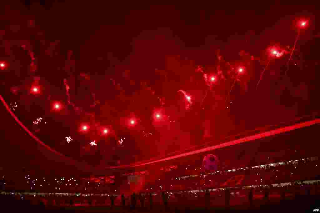 Fireworks light the sky during the opening ceremony of the Arab Club Championship football match between Saudi Arabia's al-Hilal and Tunisia's Etoile Du Sahel at the Hazza Bin Zayed Stadium in the Emirates city of al Ain on April 18, 2019.