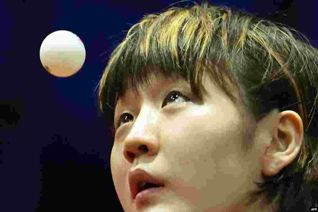 China's Chen Meng eyes the ball as she plays against Singapore's Xin Ru Wong during their women's single match at the Liebherr 2019 ITTF World Table Tennis Championships in Budapest, Hungary.