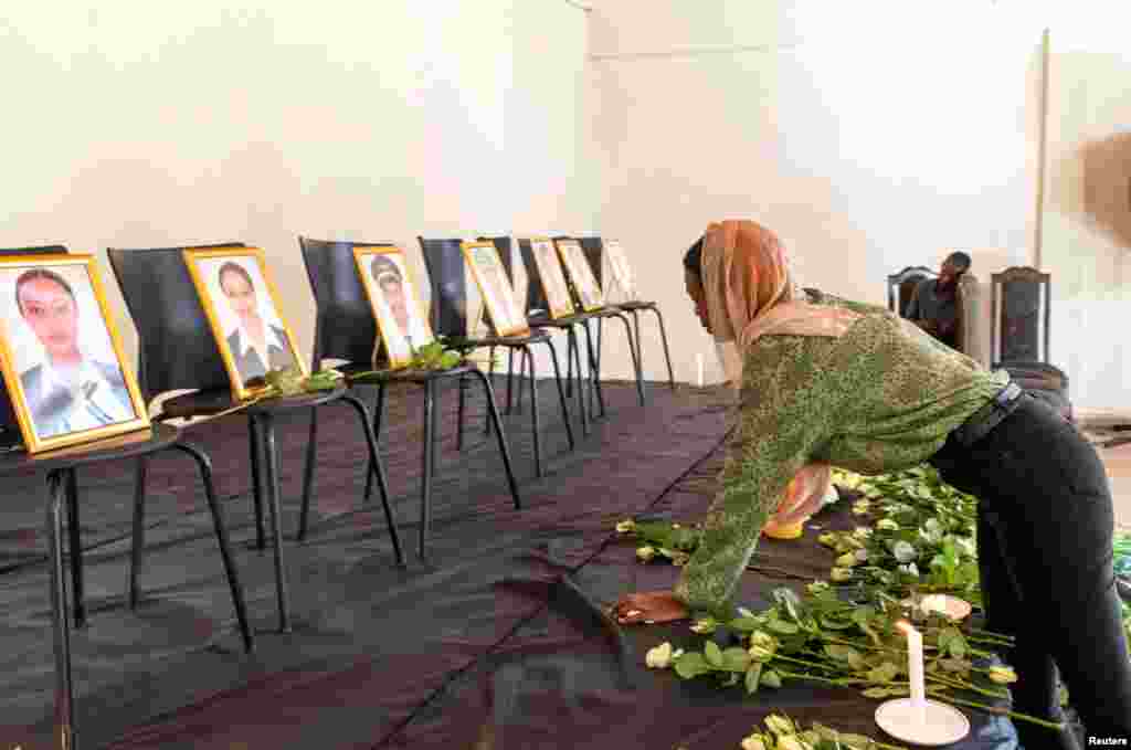 A member of the Ethiopian Airline Pilots' Association mourns as she attends a memorial service for the Ethiopian Airlines Flight ET 302 plane that crashed, in Addis Ababa, Ethiopia.