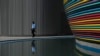 A man walks through the venue for the COP28 UN Climate Change Conference in Dubai, United Arab Emirates, Nov. 30, 2023.