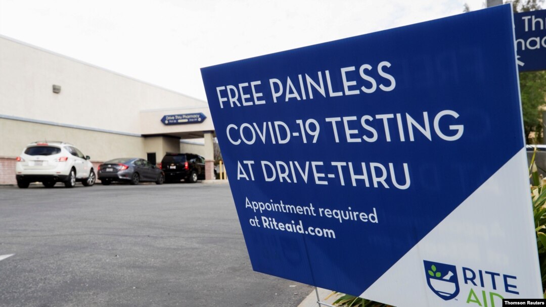Vehicles line up at a self-swabbing coronavirus disease (COVID-19) test at a Rite Aid drive-thru during the outbreak of COVID-19, in Pasadena, Jan. 25, 2021.