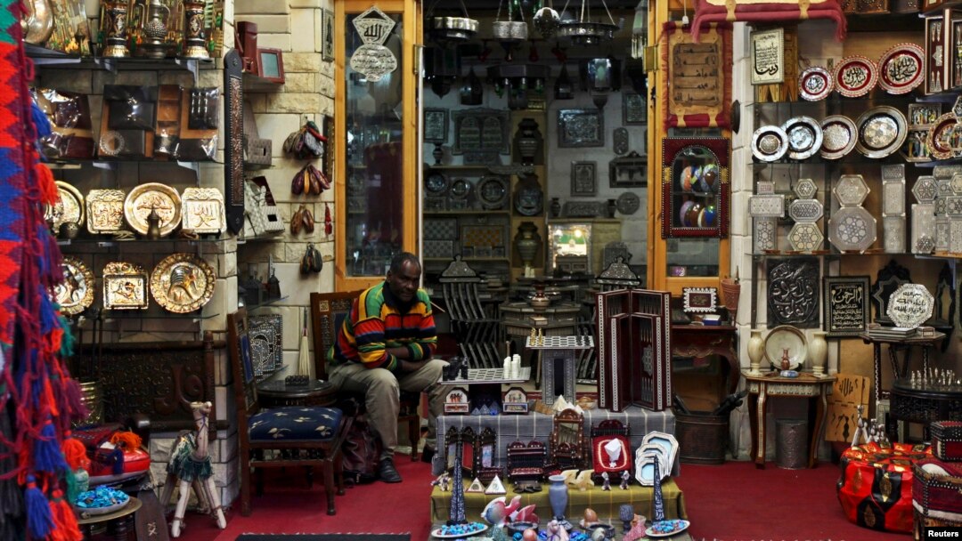 A man waits tourists at a souvenirs shop at the Khan el-Khalili market in Old Cairo, March 17, 2013. 