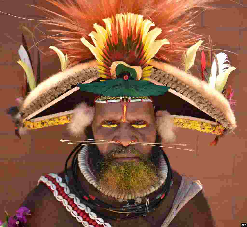 A local tribesman waits to see China's President Xi Jinping during his visit to the Butuka Academy school in Port Moresby, Papua New Guinea, ahead of the Asia-Pacific Economic Cooperation (APEC) summit.