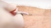 FILE - A nurse draws a blood sample during a testing campaign to prevent HIV infection in Bangkok, Sept. 20, 2014. 