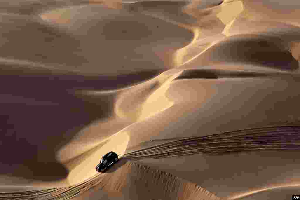 Mini's Spanish driver Nani Roma and co-driver Alexandre Haro Bravo compete during the Stage 2 of the Dakar 2019 between Pisco and San Juan de Marcona, Peru.