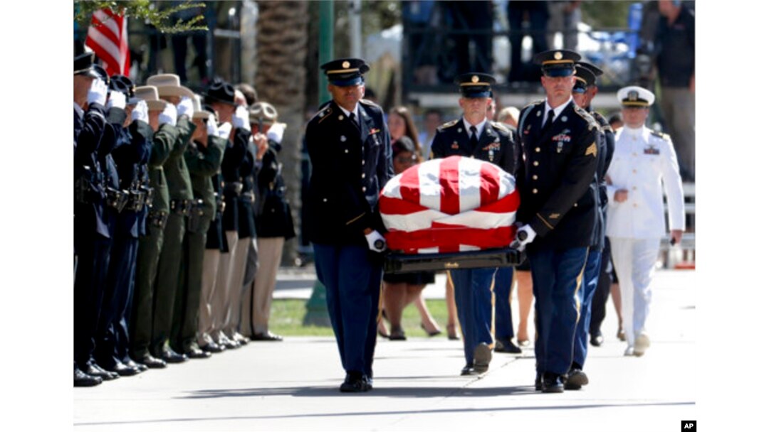 The Arizona National Guard carries the casket of Sen. John McCain, R-Ariz. during memorial service at the Arizona Capitol in Phoenix, Aug. 29, 2018.