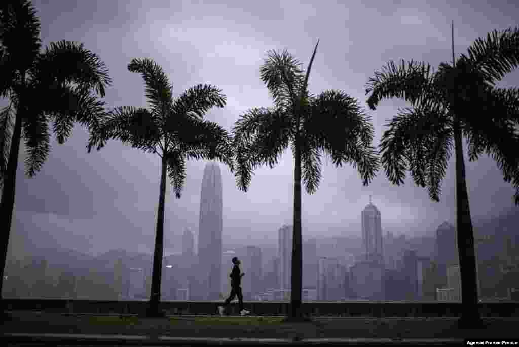 A man runs along a promenade at West Kowloon Park in Hong Kong.