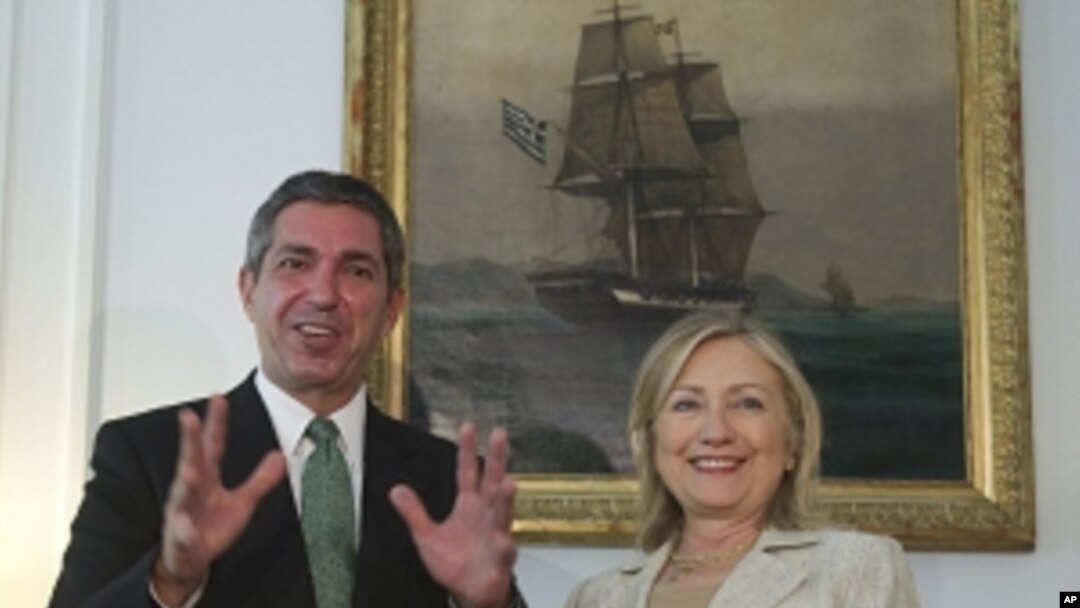 Greek Foreign Minister Stavros Lambrinidis , left, and US Secretary of State Hillary Rodham Clinton speak on Sunday July 17, 2011 during a meeting at the Ministry of Foreign Affairs in Athens