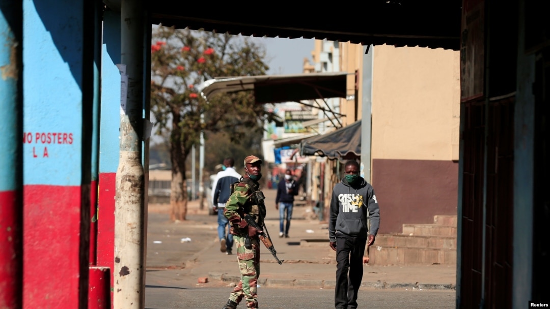 FILE - A soldier patrols the streets ahead of planned anti-government protests amid the coronavirus pandemic, in Harare, Zimbabwe, July 30, 2020.